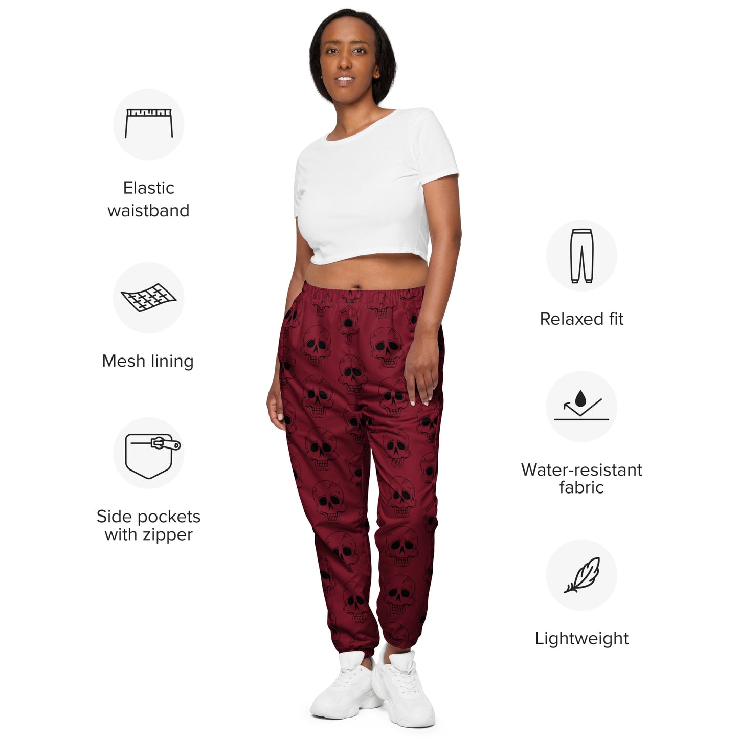 RED LAUGHING SKULL TRACK PANTS