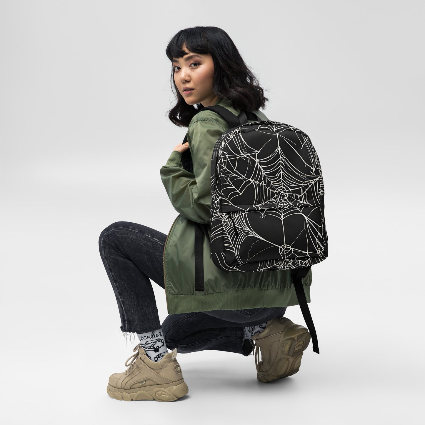 WEB OF LIES BACKPACK