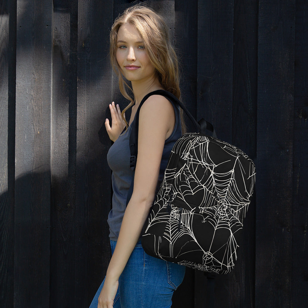 WEB OF LIES BACKPACK